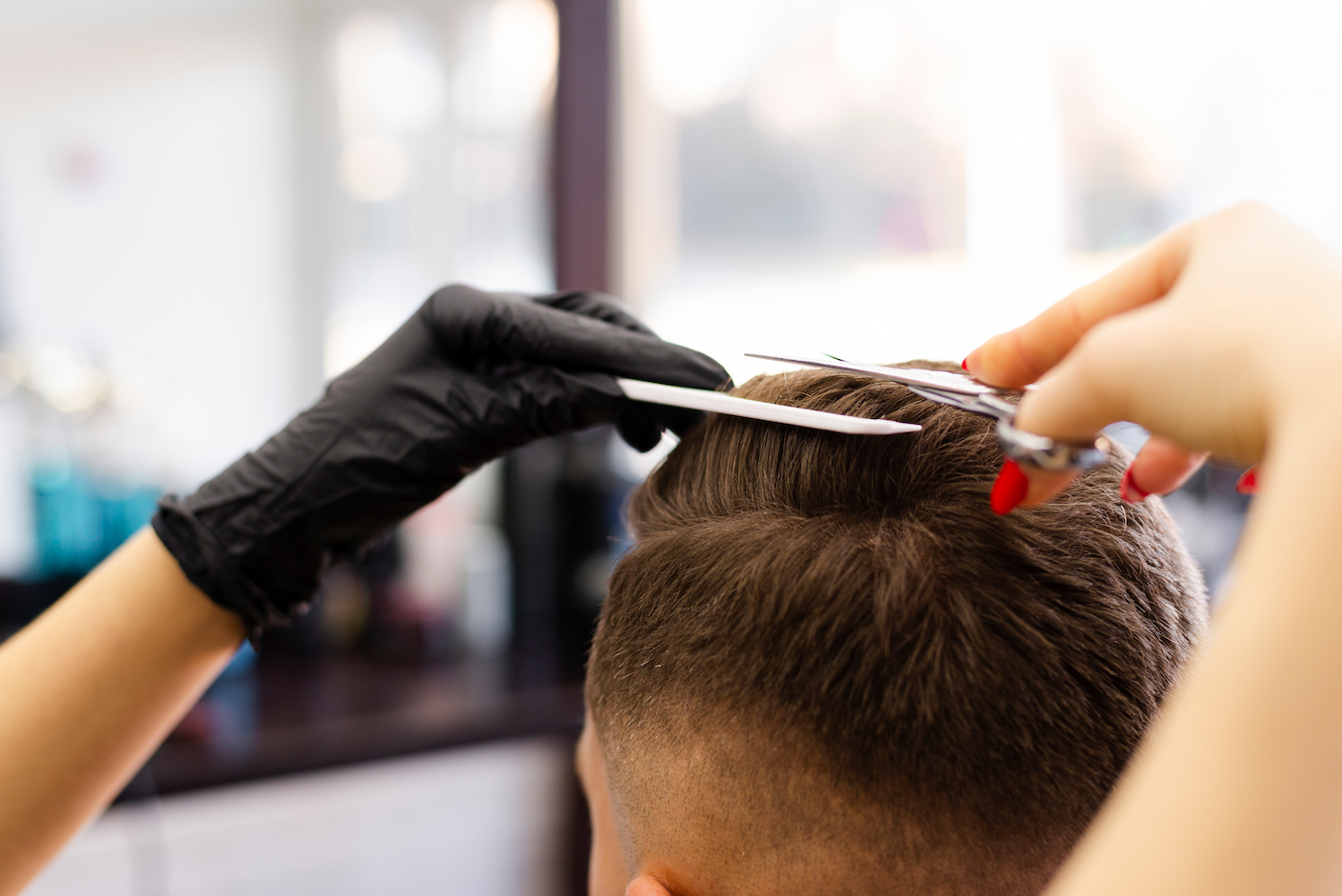 back-view-woman-cutting-her-client-s-hair.jpg