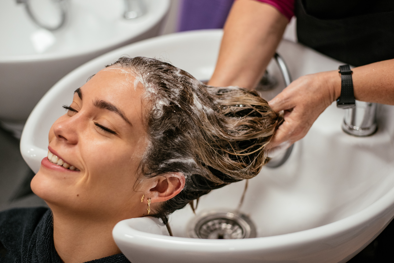 woman-having-her-hair-washed-salon